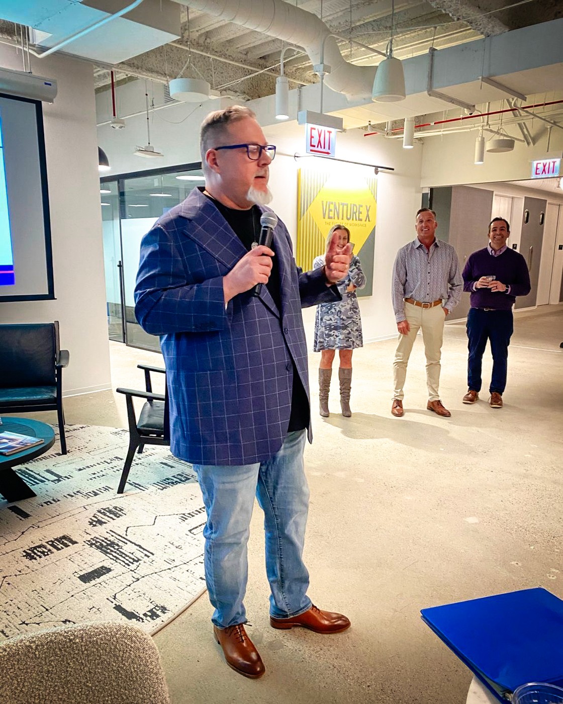 Harrison Painter speaking at a live event
