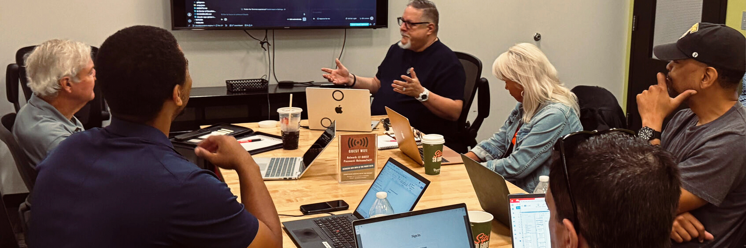 Harrison Painter leading an AI training session with a team